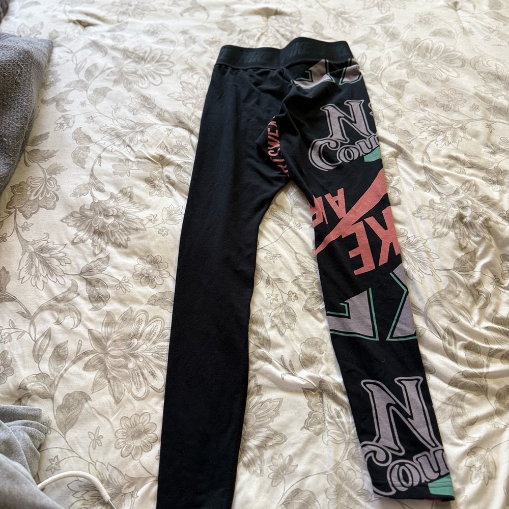 Nike Black Graphic Leggings with Pink and Green Accents